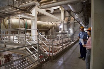 Inside the solids incineration building at the Metro Water Resources Recovery Facility. Shows many large pipes and other infrastructure.