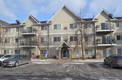 Wintertime photo of Southview Estates apartments, with cars parked in front.