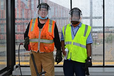 Two station cleaners take a break to smile for the camera.