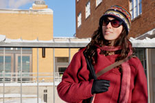 Woman in front of bus stop