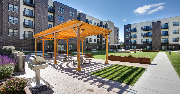 multi-unit buildings with green space, pergola