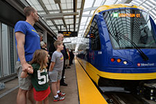 Light rail vehicle at station.