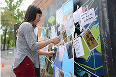 Woman pinning ideas on an idea wall