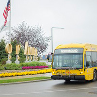 Bus in front of MOA Sign